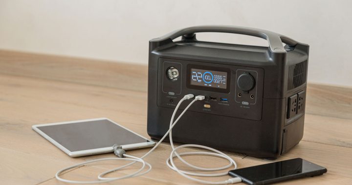 A portable power station providing backup energy, charging devices like tablets and smartphones, showcasing reliable mobile power solutions.